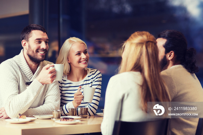 happy friends meeting and drinking tea or coffee