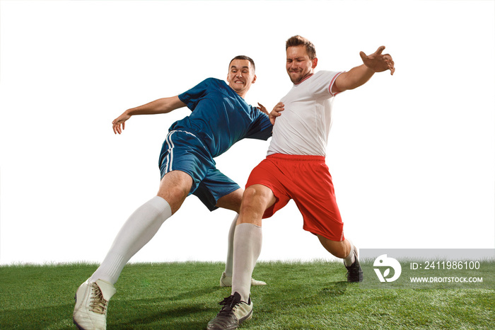 Football players tackling for the ball over white background. Professional football soccer players i