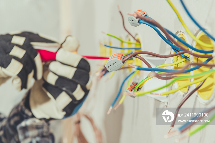 Electrcian Contractor Preparing Wires For Plug Installation.