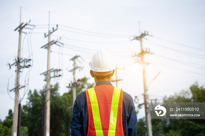 Engineering inspects the wires on the electrical pole.