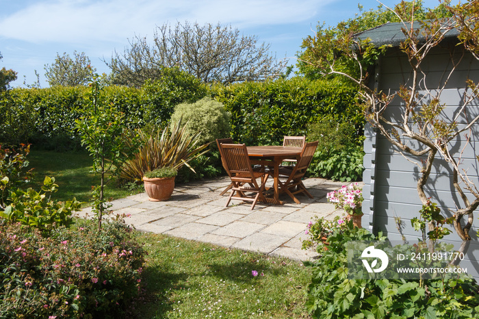 Terrace and wooden furniture in a garden