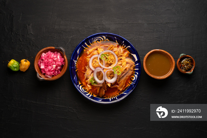 Cochinita pibil with habanero pepper and purple onion. Mexican food