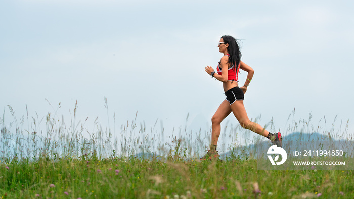 Woman runner during the preparation of a long distance trail