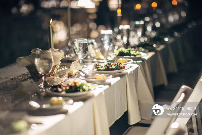 empty plated tables set for a wedding celebration dinner