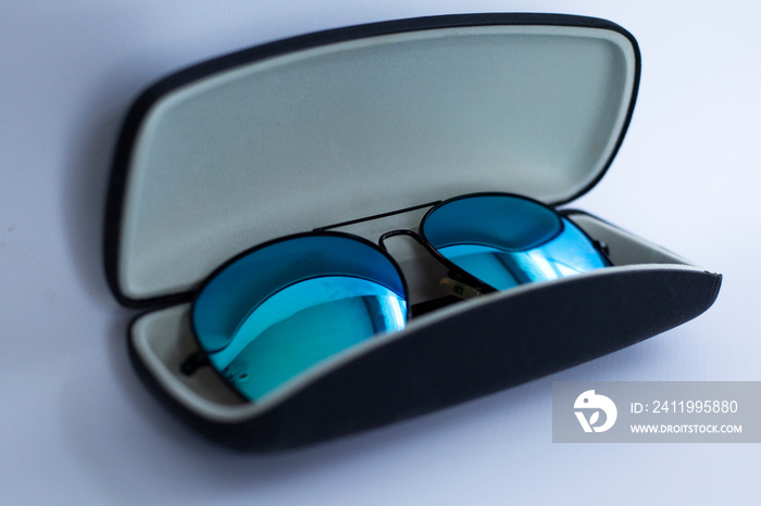 blue mirrored sunglasses in a case