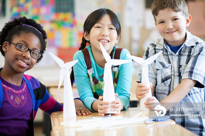 elementary students displaying wind turbine models