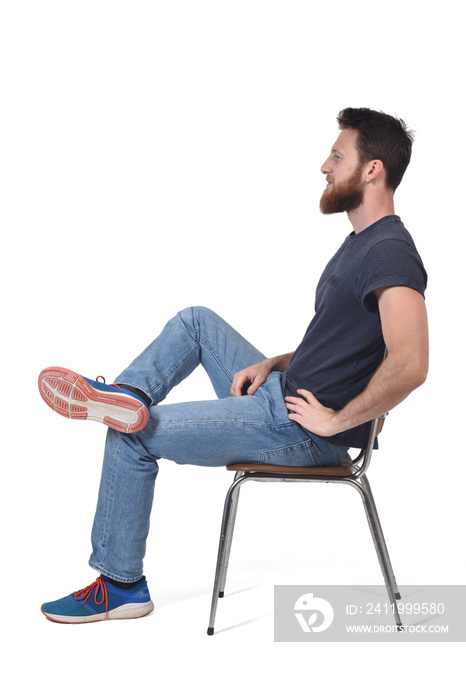 full portrait of a man sitting on a chair on white