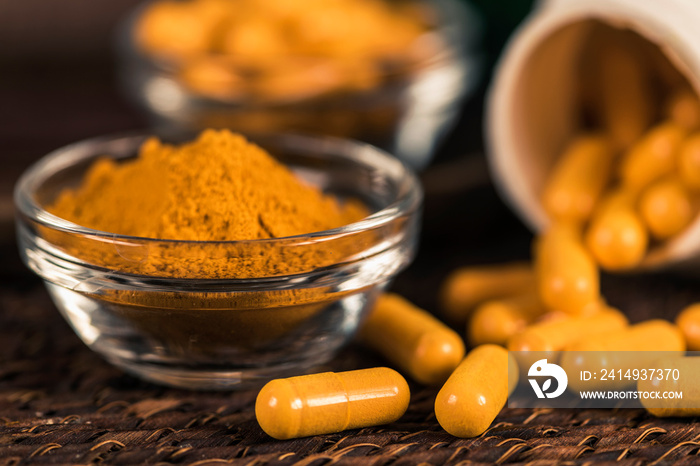 Curcumin Herbal Supplement Capsules and Turmeric Powder