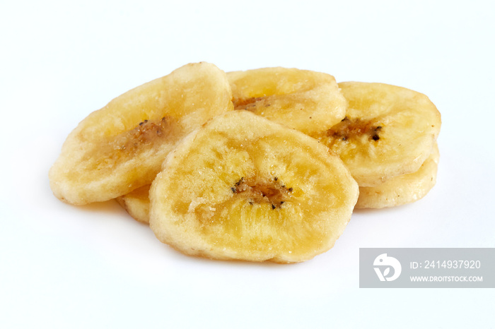 Homemade banana chips (dried and fried banana slices) isolated on white background