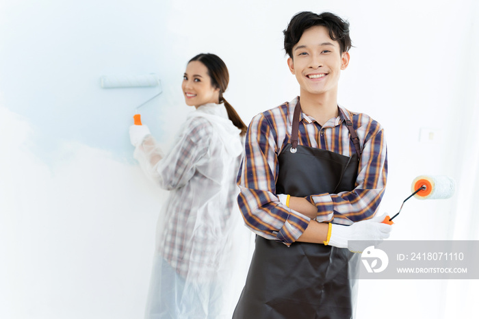 Couples are helping to paint the new house. They are happy.