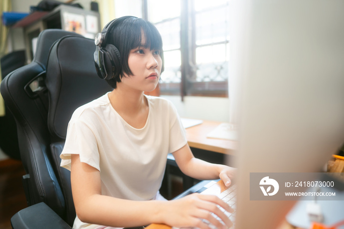 Young adult asian woman stay at home using computer for internet online.