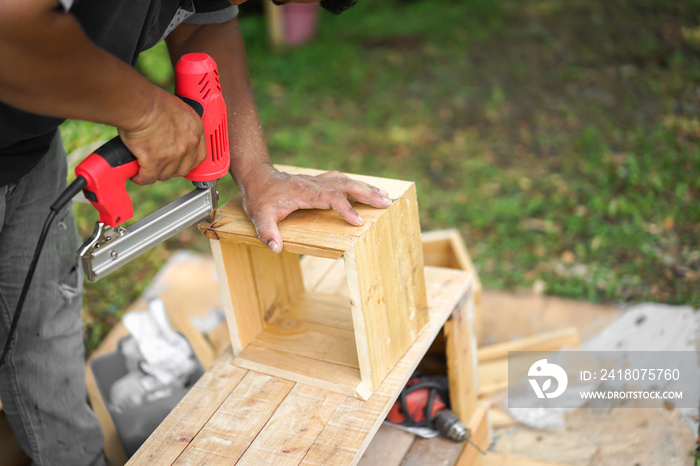 Asian carpenter are shooting Air Nailer