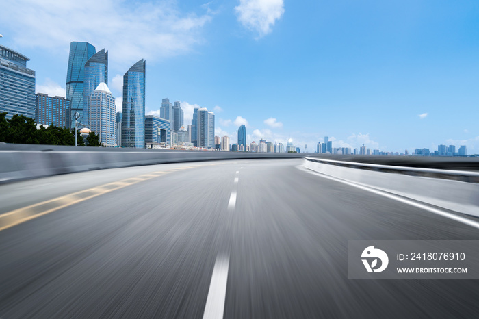 empty highway with cityscape and skyline of qingdao,China.