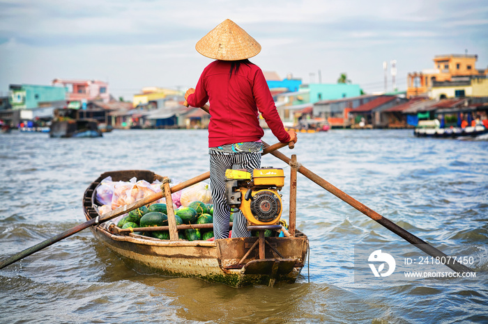 Woman selling watermelon at Floating market at Mekong Can Tho