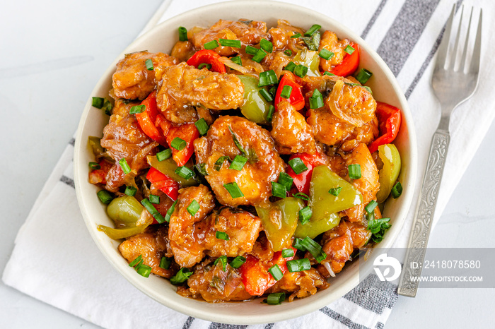 Sweet and Sour Chicken in a Bowl with Rice Directly from Above Photo. Popular American Chinese Food,