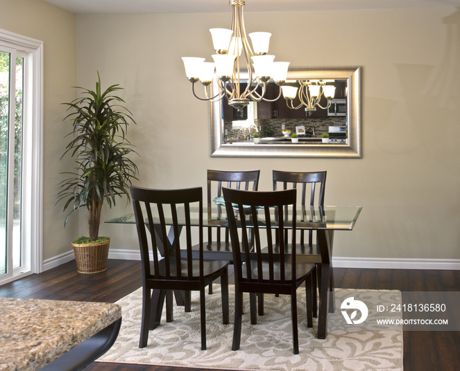 Chandelier above elegant dining table; California; United States of America