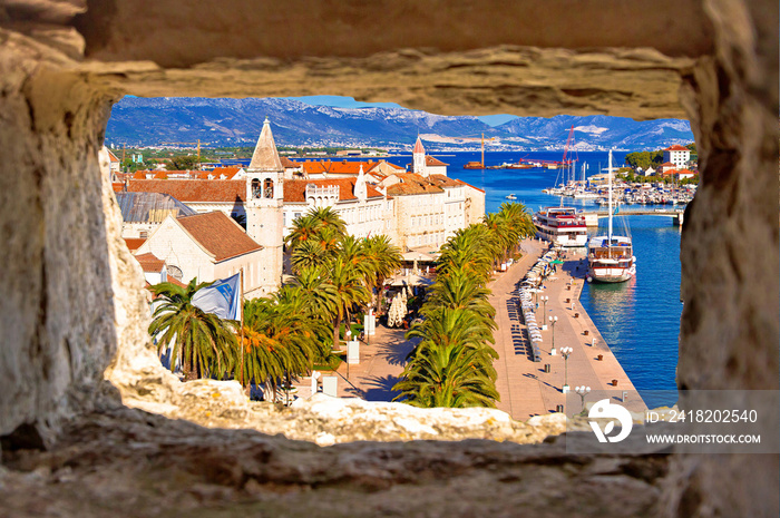 Town of Trogir waterfront and landmarks panoramic view through stone window