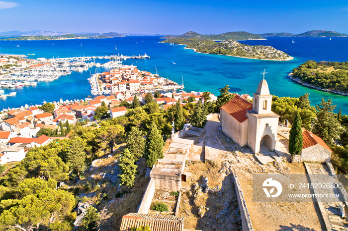 Dalmatian town of Tribunj church on hill and amazing turquoise archipelago aerial view