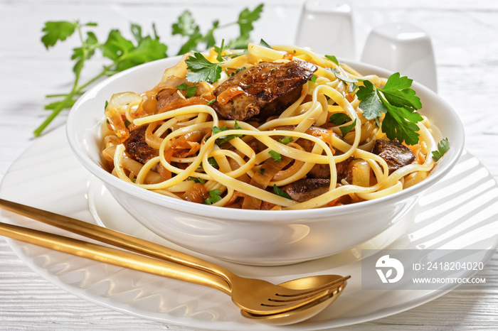 pasta linguine with fried chicken liver, top view