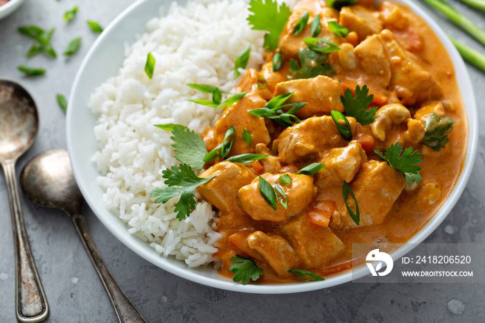 Chicken and cashew red curry with rice and herbs, thai inspired dish