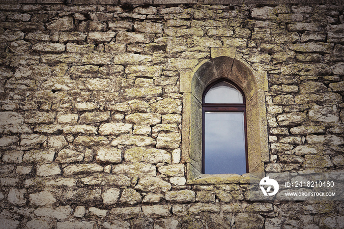 gothic window on old castle wall