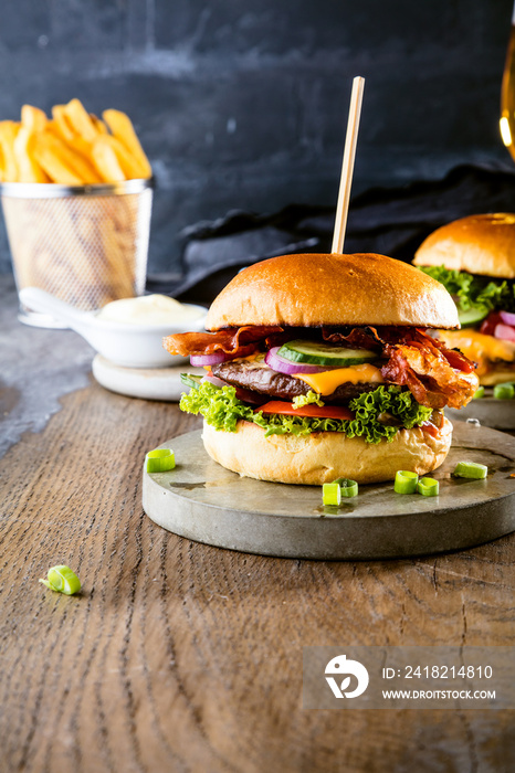 Beef burger with fries and a refreshing pint of craft beer