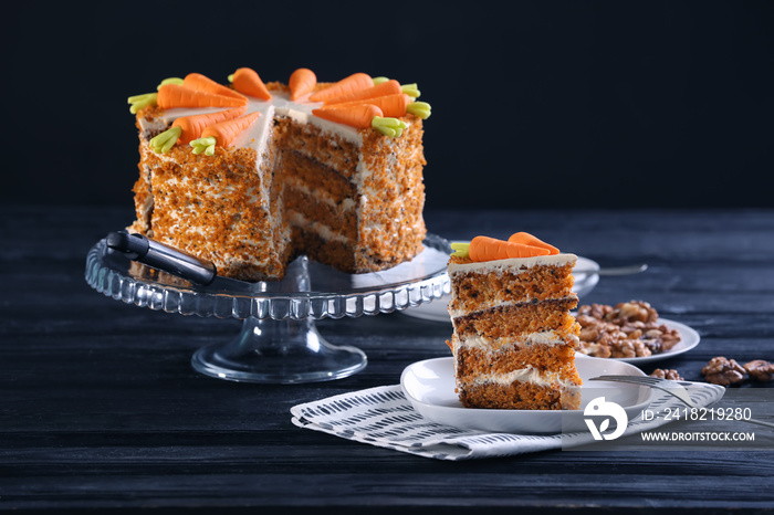 Delicious sliced carrot cake on wooden table