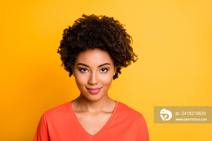 Close up photo of amazing dark skin lady in peaceful and calm mood wear orange v neck t-shirt isolat