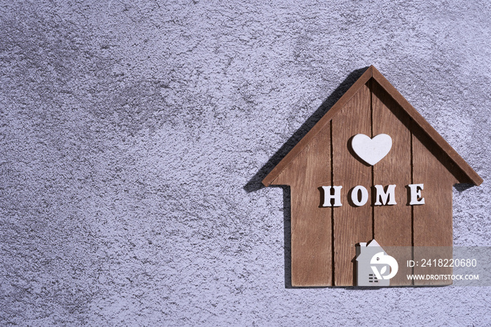 wooden model house on cement background