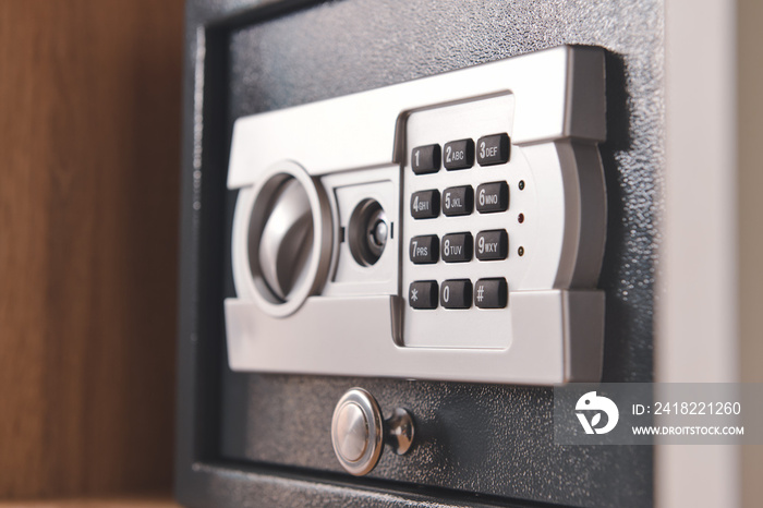 Modern safe on shelf in room