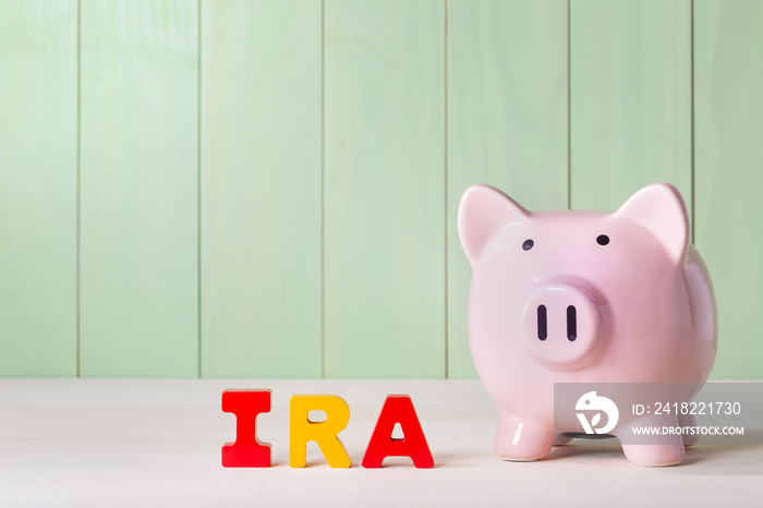 IRA theme with wood block letters and piggy bank