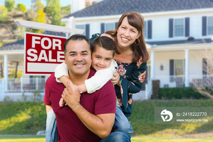 Happy Mixed Race Family In Front of House and For Sale Real Estate Sign