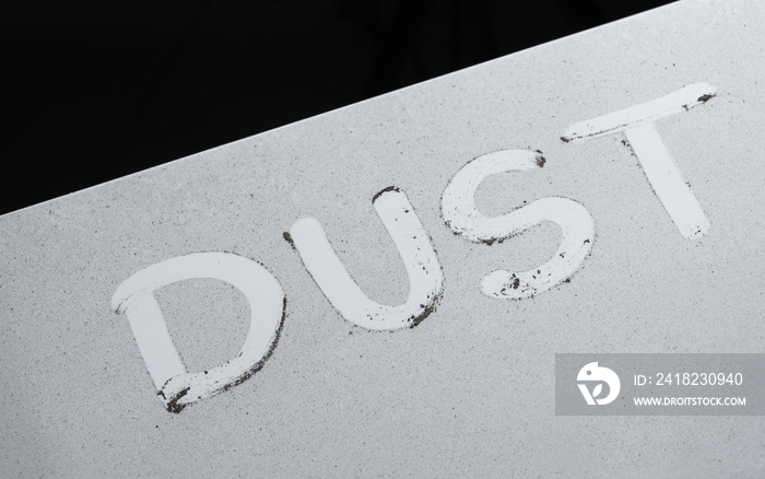 The word DUST written on on the furniture