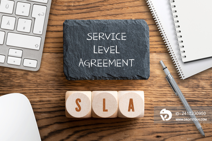 cubes with acronym SLA for  service level agreement  wooden background