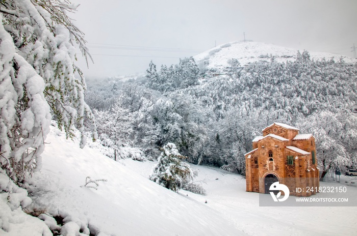 San Minguel de Lillo in snowy forest.