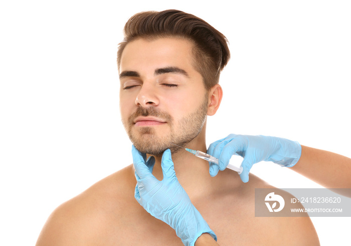 Plastic surgery concept. Man receiving injection in his face