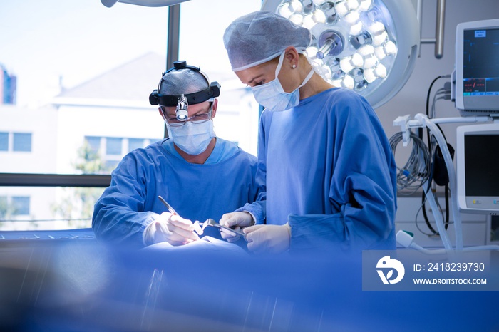 Surgeons performing operation in operation theater