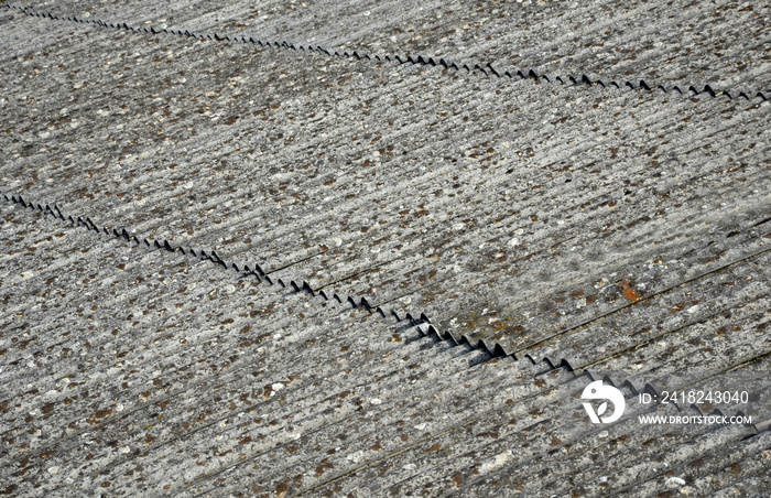 An old asbestos roof made of corrugated tiles is a hazardous environmental waste that must end up in