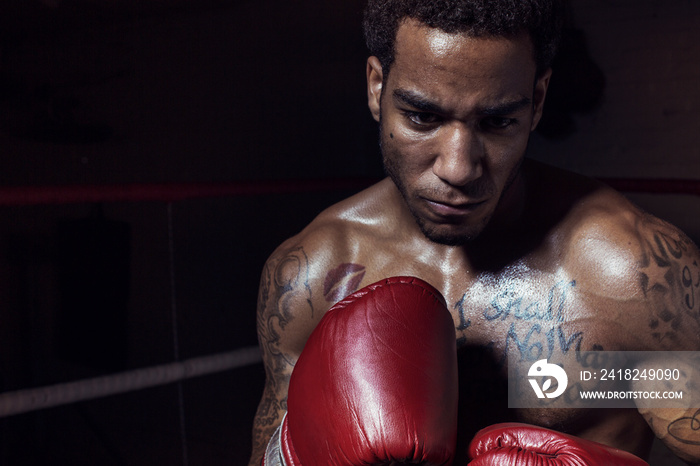 Athlete practicing in boxing ring