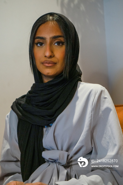 Portrait of Muslim woman at home