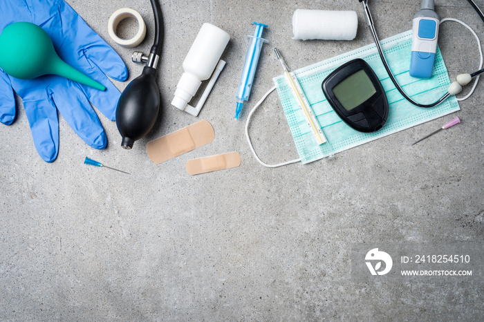 Medical equipment on gray stone background.