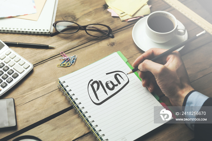 man written plan text on notebook on desk