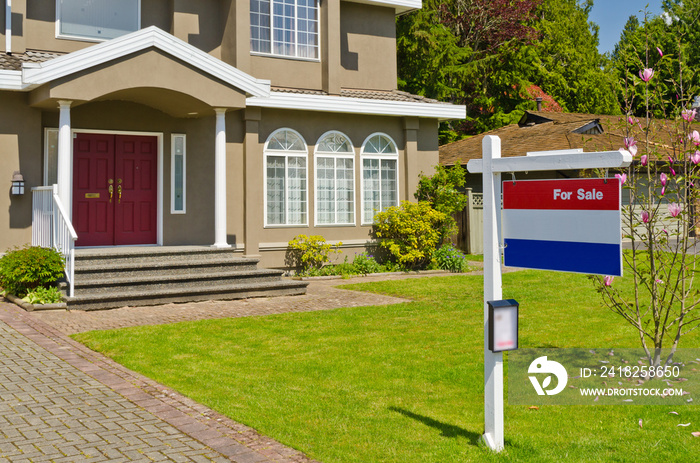 House For Sale Real Estate Sign in Front of New House.