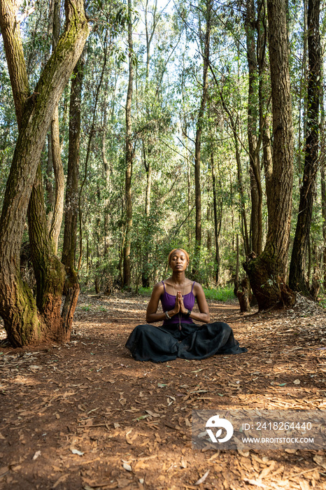 lotus pose in the woods