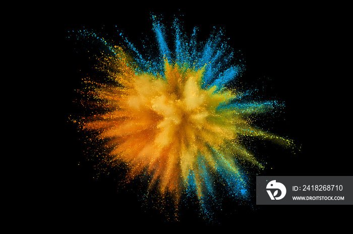 Colored powder explosion. Abstract closeup dust on backdrop. Colorful explode. Paint holi