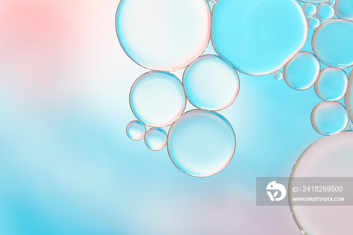 Bright and unique oil drops, circles on the water surface. Unusual background. Colorful wallpaper of