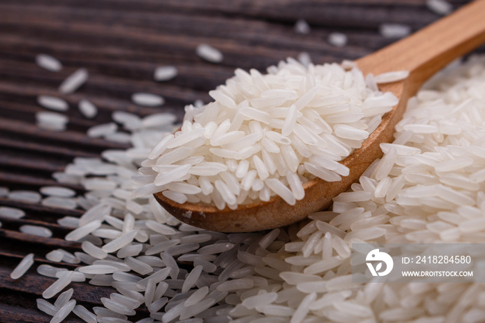 Jasmine rice on a wooden rustic background