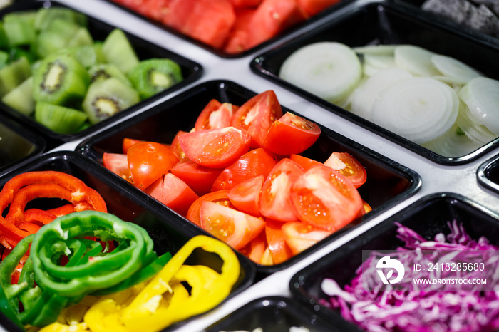 Fresh Vegetables and Fruits sliced in Salad Bar buffet