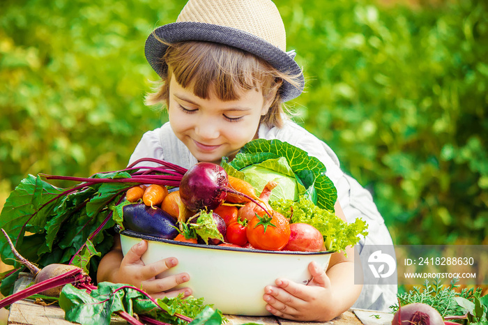 Child and vegetables. Selective focus.