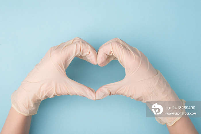 Save life concept. Cropped top above overhead close up photo of hands making giving shape of heart w